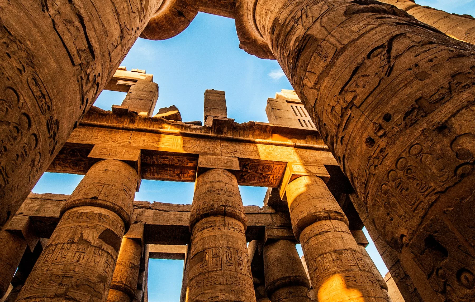 Golden sunlight across the inscribed columns of Karnak in Luxor
